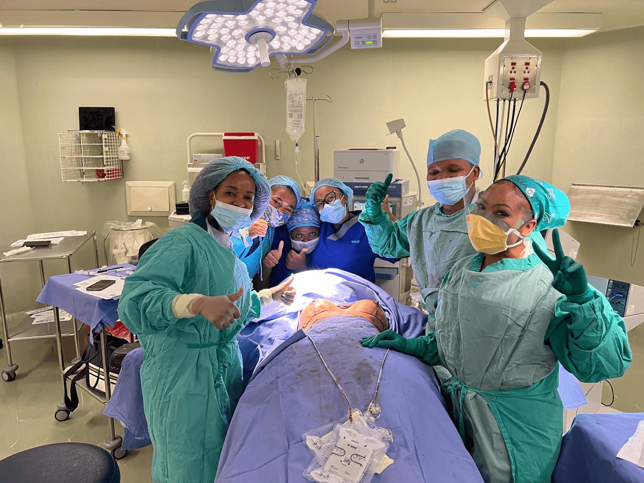 Dr. Metuse with the team